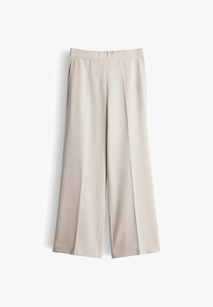 Beige, weit geschnittene Hosen aus glattem Stoff, mit hohem Bund und zwei Fronttaschen. Einheitliche Farbe, minimalistische Design-Details.
