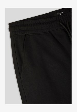 Pantaloni da jogging neri realizzati in morbido misto cotone. Presentano un'elastico in vita, tasche laterali e un design semplice e pulito.