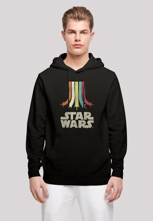 Svart hettegenser med et flerfarget, retro-inspirert "Star Wars" grafikk og framlomme. Mykt stoff med en avslappet passform.