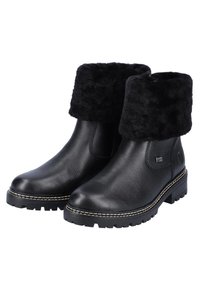 Bottines en cuir noir avec une douce bordure en fausse fourrure noire, semelle texturée robuste et détail de couture blanche le long du bord de la semelle.