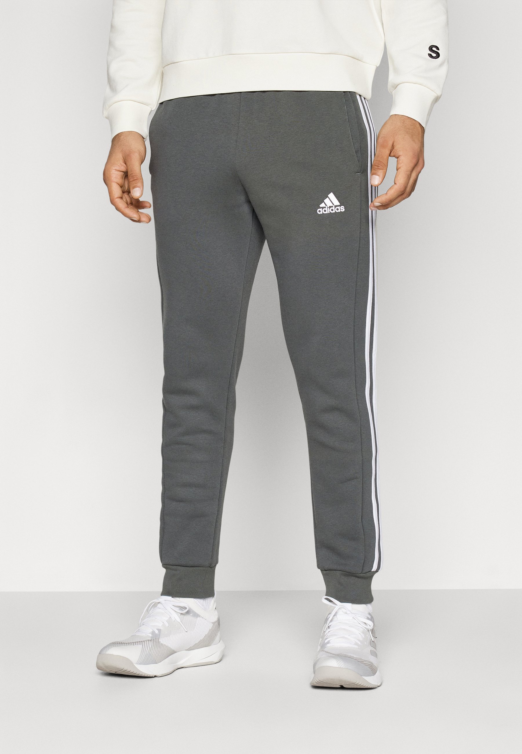 adidas Sportswear ESSENTIALS TAPERED CUFF PANTS - Tracksuit bottoms -  legend ivy/khaki 