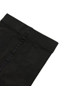 Leggings de algodón negros con una cinturilla ancha y texturizada. Presentan una superficie suave y costuras mínimas a lo largo de los laterales.