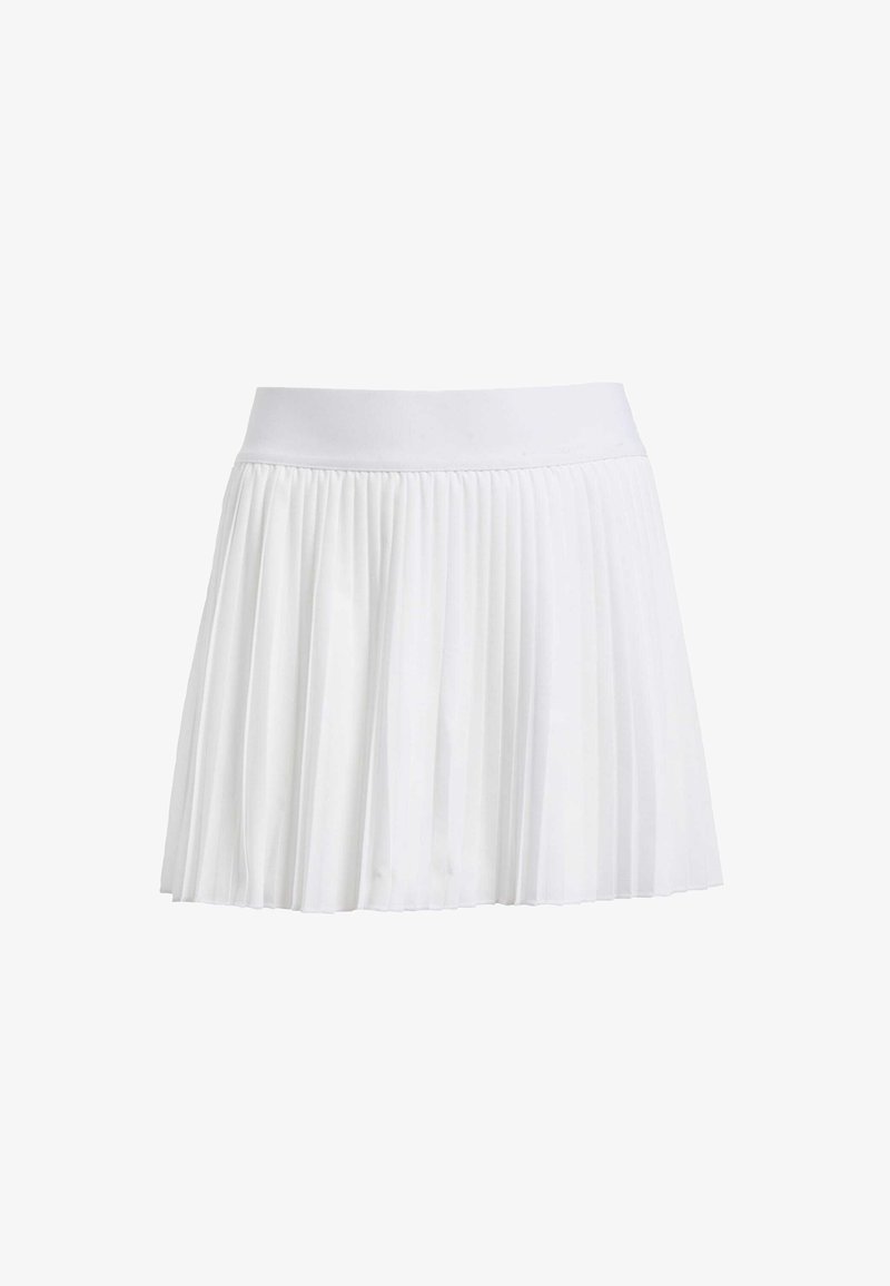 Jupe plissée blanche avec une ceinture élastique douce et un tissu léger ; conçue pour un aspect fluide et superposé.