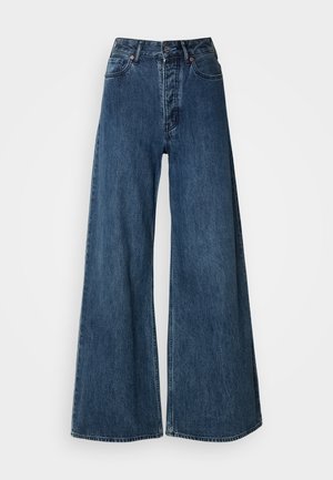 Jeans en denim à jambes larges bleu foncé, avec une taille haute, un design à cinq poches et des coutures contrastées. Tissu classique et durable.