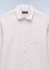 Lightly striped button-up shirt in soft fabric, featuring a spread collar, patch pocket, and white buttons against a pale background.