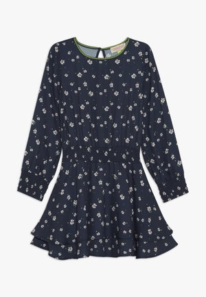 Marineblauwe jurk met lange mouwen, witte bloemenprint, gerimpelde taille en manchetten, gelaagde zoom van de rok en een ronde hals met een schakelgat aan de achterkant.