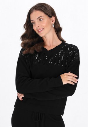 - Sweter