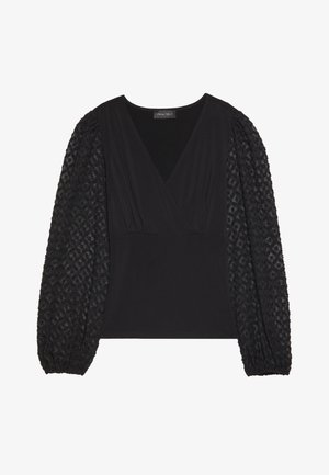 Black top featuring a V-neck, fitted bodice, and textured puff sleeves with a diamond pattern. Made of soft, stretchy material.