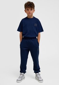 Hummel CLEAN ADJUSTABLE - Trainingsbroek - black iris