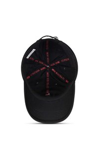 Black baseball cap viewed from inside, showing red text "U.S. Polo Assn. 1890" on internal seams and a fabric size label.