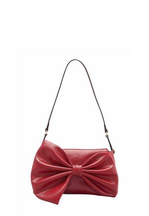Red leather shoulder bag with a large, decorative bow on the front and a thin black strap for carrying.
