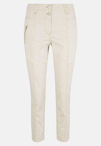 Pantalon beige pour femmes, coupe slim, avec fermeture à double bouton, poche latérale zippée et détails de panneaux cousus sur les jambes.