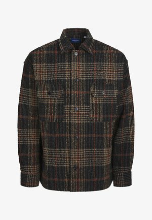 Black plaid shirt in textured fabric features beige and rust-colored lines, button front, and two chest pockets.