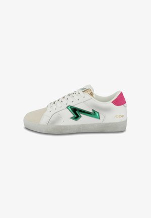 White sneaker with green metallic lightning bolt detail, pink heel tab, and soft suede toe cap. Features textured rubber sole and laces.