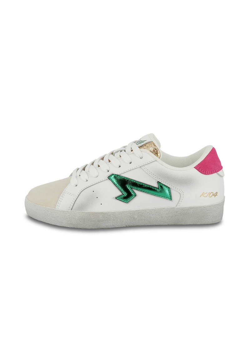 White sneaker with green metallic lightning bolt detail, pink heel tab, and soft suede toe cap. Features textured rubber sole and laces.