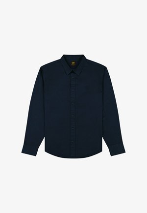 Chemise à manches longues bleu marine en coton. Dotée d'un col semi-italien, d'une patte de boutonnage à l'avant et d'un logo discret sur la poitrine gauche.