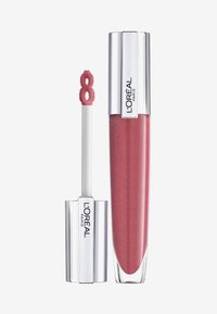 Glossy lip gloss dans un emballage transparent rose avec un capuchon argenté. Comprend un applicateur en forme de huit recouvert de peluche.