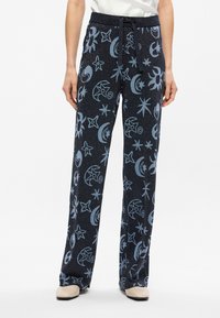 Pantalons noirs à jambe large avec des motifs d'étoiles et de lunes en bleu clair. Fabriqués dans un tissu texturé et pailleté avec une taille à cordon.