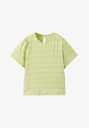 Haut à manches courtes vert clair avec un design texturé présentant un motif carré et une encolure en forme de trou à l'arrière.