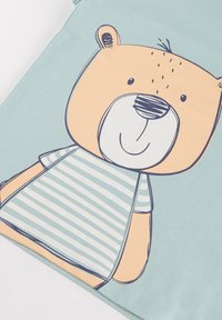 T-shirt featuring a light blue color with a bear graphic in orange and black outline, wearing a striped top with light blue and white stripes.