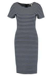 Robe ajustée à rayures bleu marine et blanche avec des manches courtes et un col rond. Fabriquée en tissu extensible, elle présente un design simple et épuré.