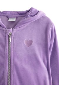Purple fleece hoodie with a full zipper. Features a small embroidered heart detail on the chest. Soft texture and hooded design.