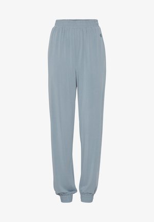Joggers bleu clair à taille élastique avec des poignets côtelés, fabriqués dans un tissu doux ; présentent un petit logo près de la taille pour le détail.