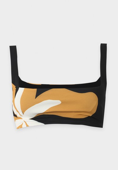 Μαύρο cropped top με φαρδιές τιράντες που διαθέτει μεγάλο αφηρημένο λουλουδάτο σχέδιο σε μουσταρδί κίτρινο και λευκό μπροστά.
