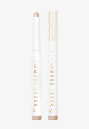 Bobbi Brown highlighter stick met een lichtroze punt en een witte buis met gouden accenten en sterpatronen, cilindrische vorm, gladde textuur.