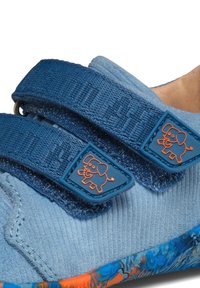 Blue toddler shoe with two adjustable straps featuring orange cartoon elephant, textured fabric, and multicolored blue-orange sole.