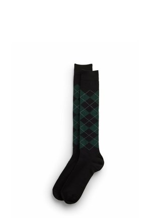 Ein Paar schwarze knielange Socken mit dunkelgrünem und schwarzem Argyle-Rautenmuster im Beinbereich.