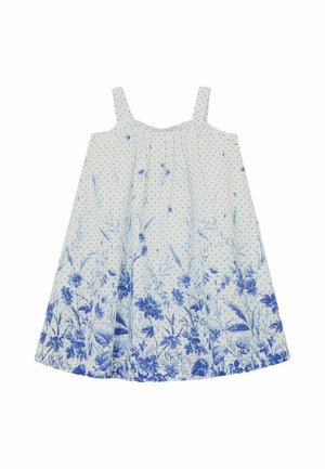Vestido blanco sin mangas con tirantes finos, pequeños lunares negros y estampado floral azul a lo largo del dobladillo.