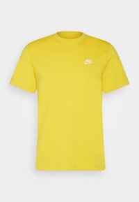 Yellow cotton t-shirt with a crew neck and short sleeves. Features a small white Nike logo on the upper left chest area.