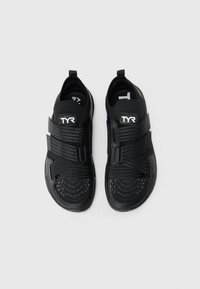 Pair of black TYR sports sandals with two wide velcro straps and a breathable mesh toe area, shown from above on a white background.