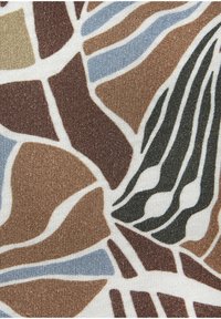 Patterned fabric featuring abstract organic shapes in brown, blue, and black on a beige background, textured knit with a slight sheen.