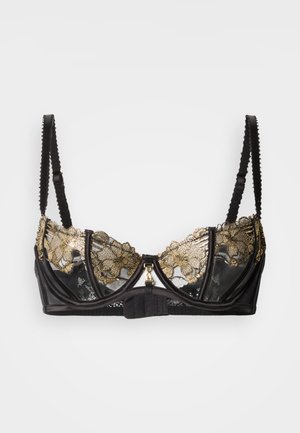 Soutien-gorge en dentelle noire avec broderie florale dorée, armatures, bretelles réglables et fermeture frontale ornée d'un accent doré.