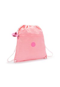Mochila rosa de cuerdas con un bolsillo frontal con cremallera y un pequeño llavero de peluche en forma de mono rosa.