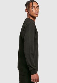Merchcode RECKLESS BASIC CREWNECK - Sweatshirt - black