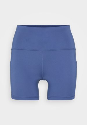 Magas derekú kék sportnadrág, elasztikus szövetből készült, sima tapintású, testhezálló kialakítással, oldalán zsebekkel a kényelem érdekében.