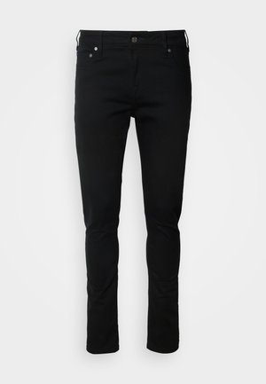 Sorte denim jeans med en slank pasform, featuring en lynlås foran, bæltestropper og forlommer. Glat tekstur, minimal detailing, klassisk design.
