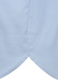 Light blue fabric features a smooth texture with a stitched seam, creating a rounded hem detail at the bottom.