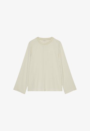 Ilga rankovė, kreminės spalvos viršutinė dalis su apvaliu iškirpimu ir laisvu siluetu. Sklandi medžiaga su nedideliu blizgesiu, be raštų ar puošmenų.