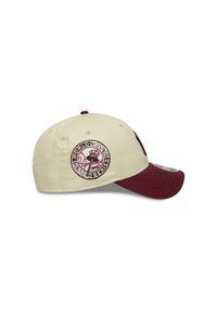 Cream and maroon baseball cap featuring a round embroidered logo with "World Series 1949" and a baseball bat design. Structured shape, curved visor.