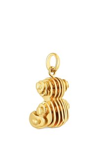 Złocony metalowy wisiorek z żłobionym wzorem i zaokrąglonymi akcentami, łączący gładkie i fakturowane powierzchnie. W komplecie zawieszka z pierścieniem.