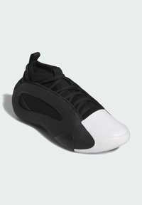 Sneaker in bianco e nero caratterizzato da un design elegante e arrotondato; tomaia in rete, suola in gomma testurizzata e chiusura con lacci per una calzata sicura.