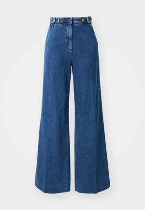 Bredde bukser i mørkeblå denim med høy midje, med gullknappdetaljer og sømmer langs lommene og sømmene.