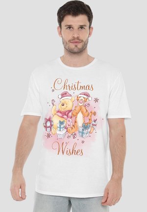 Man wearing white shirt with Winnie the Pooh and Tigger in Santa hats, surrounded by gifts and candy canes, text "Christmas Wishes."