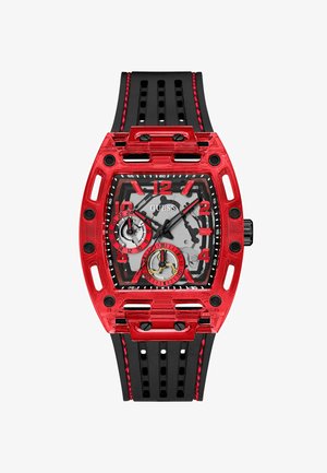 Crvena prozirna kućišta sat sa crnom gumenom narukvicom. Kvadratni brojčanik ima sivi pozadinu, crvene naglaske i crne oznake sati.