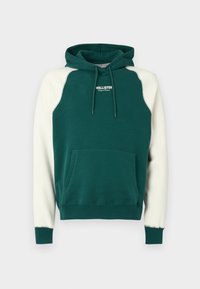 Green and cream hooded sweatshirt with a front pocket, featuring a logo on the chest and contrasting sleeves in a raglan design.