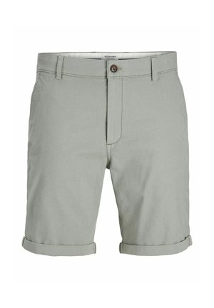 Svijetlozelene kratke hlače izrađene od teksturirane tkanine. Imaju preklopne rukave i jedan smeđi gumb u struku. Uključena su dva prednja džepa.